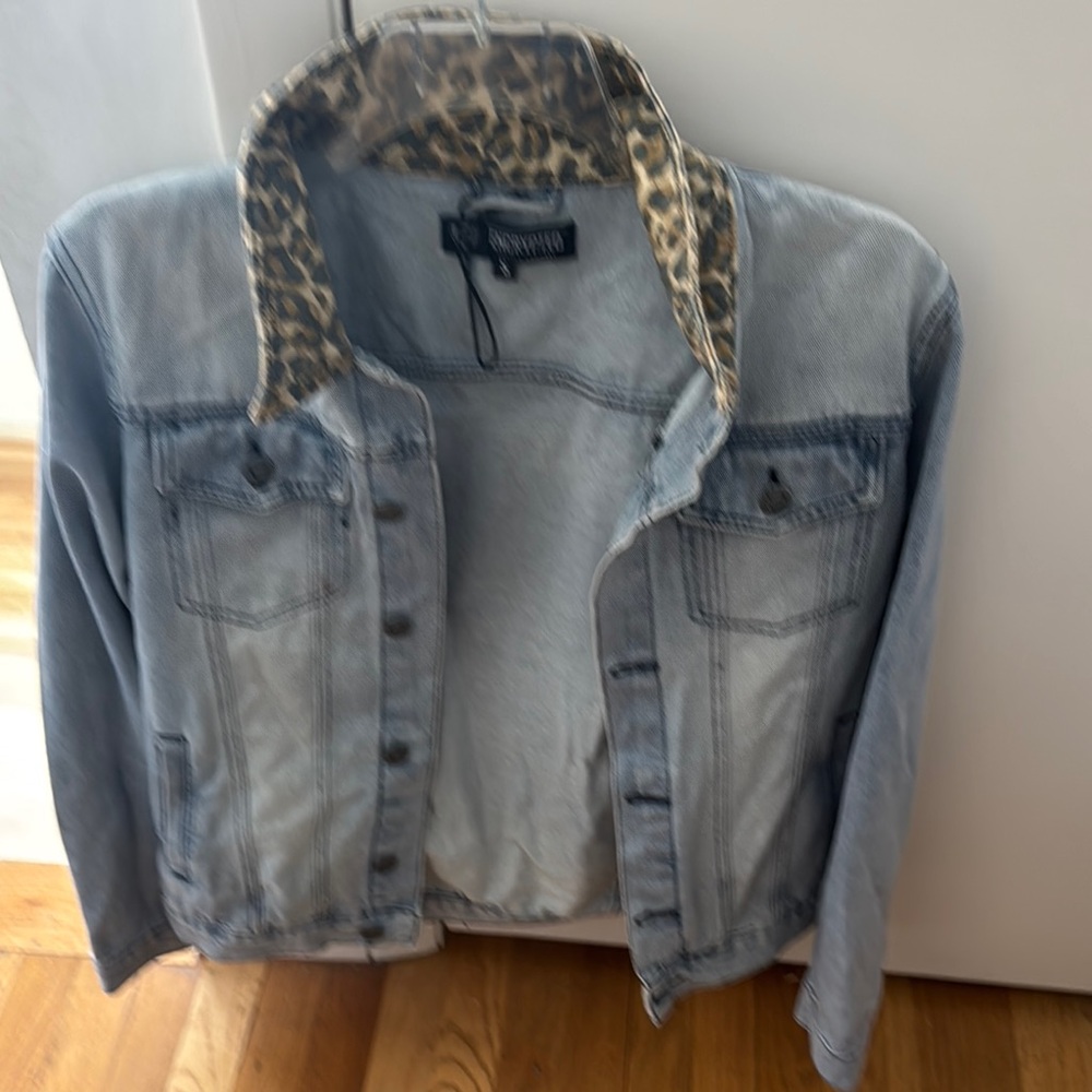 Brand new, never been worn Jean jacket with cheetah collar.